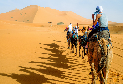 Luxury desert camp tents under stars in Merzouga Sahara Luxury desert camp tents under starry night sky in Merzouga